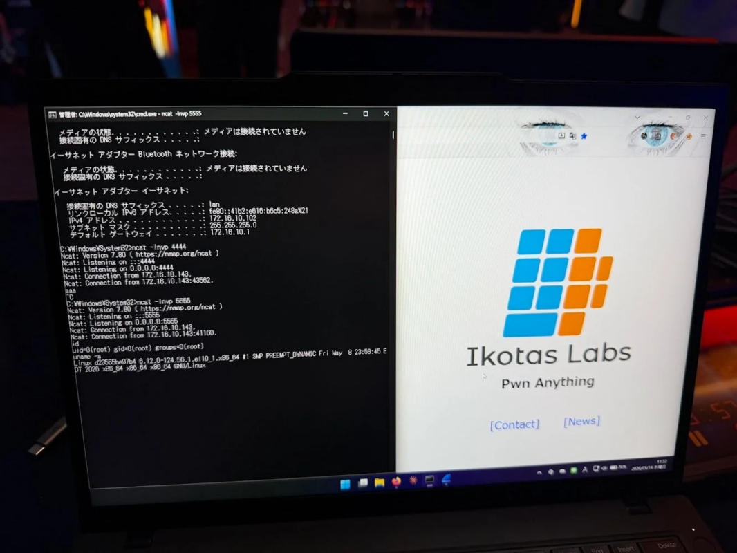 ノートパソコンの画面に、左側はネットワーク設定やncatの通信状況、Linuxシステム情報が表示されたコマンドプロンプト、右側は「Ikōtas Labs」のロゴと「Pwn Anything」のスローガンが表示されたウェブページが映し出されている